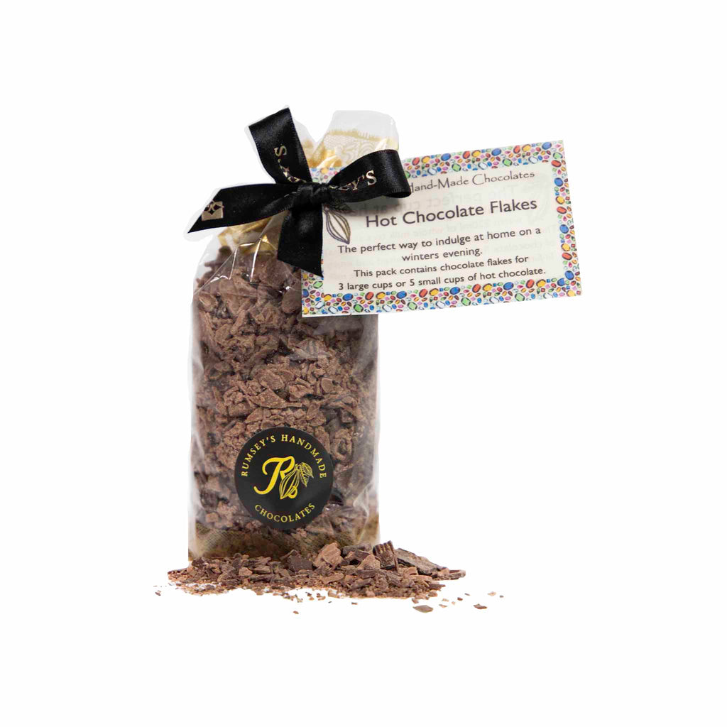 A bag of artisan hot chocolate flakes hand wrapped and tied with black ribbon special gift for valentine's